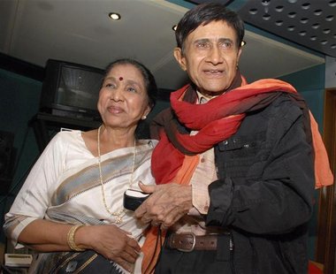 Veteran Bollywood actor Anand and singer Bhosle pose in Mumbai Veteran Bollywood actor Anand and singer Bhosle pose in Mumbai