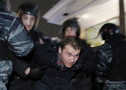 Russian police detain a participant during an opposition protest in central Moscow Russian police detain a participant during an opposition protest in central Moscow