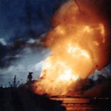 The USS Arizona is seen ablaze, immediately following the explosion of its forward magazines after the Japanese attack in Pearl Harbor, Hawa The USS Arizona is seen ablaze, immediately following the explosion of its forward magazines after the Japanese attack in Pearl Harbor, Hawa