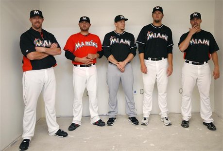 Members of the Florida Marlins wait to be interviewed after announcing their new uniforms for the upcoming baseball season in Miami Members of the Florida Marlins wait to be interviewed after announcing their new uniforms for the upcoming baseball season in Miami