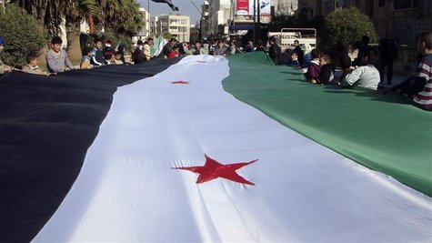 Demonstrators protesting against Syria's President Bashar al-Assad display a 1961-63 Syrian flag during a march through the streets in Adlb. Demonstrators protesting against Syria's President Bashar al-Assad display a 1961-63 Syrian flag during a march through the streets in Adlb.