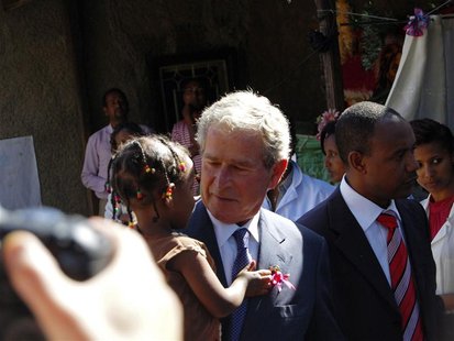 Former President Bush carries Ethiopian child whose mother is receiving HIV treatment through programmes funded by PEPFAR in Addis Ababa Former President Bush carries Ethiopian child whose mother is receiving HIV treatment through programmes funded by PEPFAR in Addis Ababa