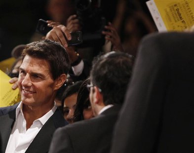 U.S. actor Cruise poses with fans as he arrives for the 8th Dubai International Film Festival U.S. actor Cruise poses with fans as he arrives for the 8th Dubai International Film Festival