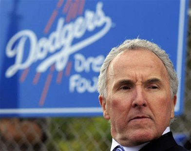 Los Angeles Dodgers owner McCourt listens during the unveiling of a new Dodgers baseball field for children in Compton Los Angeles Dodgers owner McCourt listens during the unveiling of a new Dodgers baseball field for children in Compton