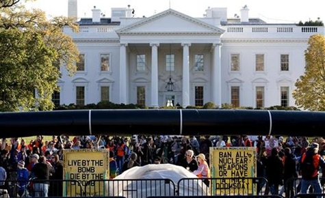 Demonstrators carry a giant mock pipeline while calling for the cancellation of the Keystone XL pipeline during a rally in Washington Demonstrators carry a giant mock pipeline while calling for the cancellation of the Keystone XL pipeline during a rally in Washington