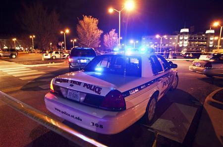 Law enforcement officers are seen at the site where a Virginia Tech police officer was shot and killed at Virginia Tech University Blacksburg, Virginia December 8, 2011.
Credit: REUTERS/Chris Keane Law enforcement officers are seen at the site where a Virginia Tech police officer was shot and killed at Virginia Tech University Blacksburg, Virginia December 8, 2011.
Credit: REUTERS/Chris Keane