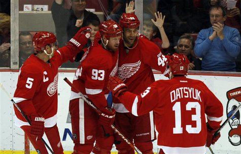 Detroit Red Wings' Bertuzzi celebrates with his teammates after he scored against the Winnipeg Jets during the first period of their NHL hoc Detroit Red Wings' Bertuzzi celebrates with his teammates after he scored against the Winnipeg Jets during the first period of their NHL hoc