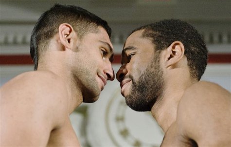 Khan goes nose-to-nose with Peterson at the weigh-in for their upcoming boxing match in Washington Khan goes nose-to-nose with Peterson at the weigh-in for their upcoming boxing match in Washington