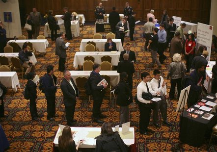 Job seekers stand in line to speak with employers at a job fair in San Francisco Job seekers stand in line to speak with employers at a job fair in San Francisco