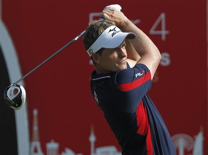 Donald of England watches his shot from the 10th tee during the final round of the Dubai World Championship in Dubai Donald of England watches his shot from the 10th tee during the final round of the Dubai World Championship in Dubai