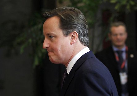 Britain's Prime Minister Cameron leaves the European Council headquarters after a night of negotiations at a European Union summit in Brusse Britain's Prime Minister Cameron leaves the European Council headquarters after a night of negotiations at a European Union summit in Brusse