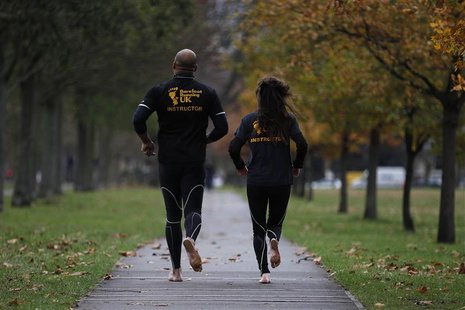 Robinson and Toombs run barefoot in a park in south London Robinson and Toombs run barefoot in a park in south London