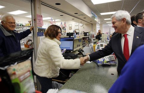 Republican presidential candidate and former Speaker of the House of Representatives Newt Gingrich greets voters at Hollis Pharmacy in Holli Republican presidential candidate and former Speaker of the House of Representatives Newt Gingrich greets voters at Hollis Pharmacy in Holli