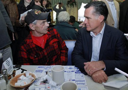 Republican presidential candidate and former Massachusetts Governor Romney talks to Vietnam War veteran at Chez Vachon Restaurant in Manches Republican presidential candidate and former Massachusetts Governor Romney talks to Vietnam War veteran at Chez Vachon Restaurant in Manches