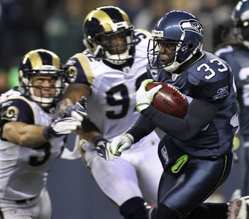 Seahawks' Washington runs for a kickoff return while avoiding being tackled by Rams Chamberlain and Sims during the second quarter of their Seahawks' Washington runs for a kickoff return while avoiding being tackled by Rams Chamberlain and Sims during the second quarter of their
