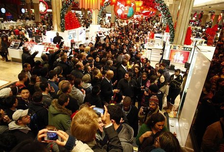 Customers shop at Macy's department store in New York. Customers shop at Macy's department store in New York.