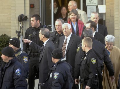 Former Penn State assistant football coach Sandusky is surrounded by police as he departs from a preliminary hearing in Bellefonte Former Penn State assistant football coach Sandusky is surrounded by police as he departs from a preliminary hearing in Bellefonte