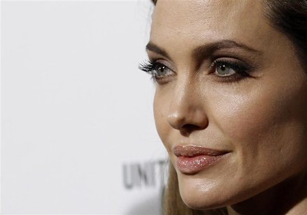 Jolie poses at the premiere of "In the Land of Blood and Honey" in Los Angeles Jolie poses at the premiere of "In the Land of Blood and Honey" in Los Angeles