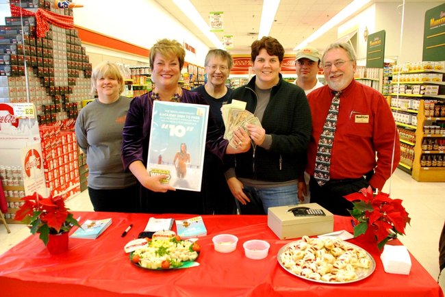 Lori Moore and the Potluck Pals descend upon Harding's on Howard St in Kalamazoo to rally support for Kalamazoo Loaves and Fishes, Dec 13, 2011.  The Pals raised $3275!