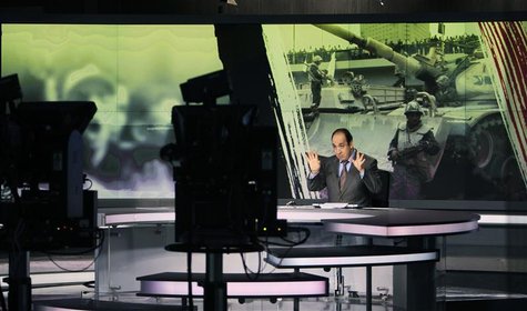 Announcer Abdul Samad Nasser is seen in the studio of the Arabic Al Jazeera satellite news channel in Doha in this February 7, 2011 file pho Announcer Abdul Samad Nasser is seen in the studio of the Arabic Al Jazeera satellite news channel in Doha in this February 7, 2011 file pho