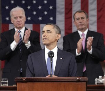 President Barack Obama is applauded by House Speaker John Boehner and Vice President Joe Biden while delivering his State of the Union addre President Barack Obama is applauded by House Speaker John Boehner and Vice President Joe Biden while delivering his State of the Union addre