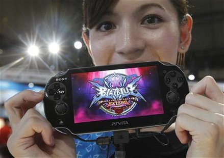 A promotional woman shows a Sony's PlayStation Vita handheld gaming device at Tokyo Game Show in Chiba A promotional woman shows a Sony's PlayStation Vita handheld gaming device at Tokyo Game Show in Chiba