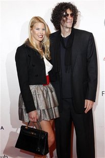 Howard Stern and his wife Beth Ostrosky pose on the red carpet before The New York Friars Club Roast of director Quentin Tarantino in New Yo Howard Stern and his wife Beth Ostrosky pose on the red carpet before The New York Friars Club Roast of director Quentin Tarantino in New Yo