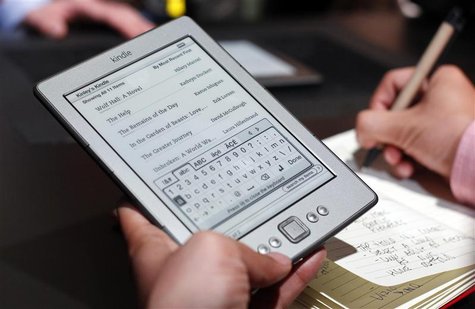 A reporter tries out a new $79 Kindle tablet at a news conference during the launch of Amazon's new tablets in New York. A reporter tries out a new $79 Kindle tablet at a news conference during the launch of Amazon's new tablets in New York.