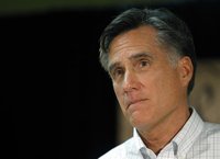 Republican presidential candidate and former Massachusetts Governor Mitt Romney listens to a question from the audience at a forum in Hudson
