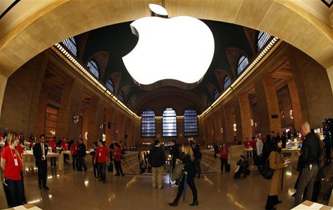 The Apple Inc. logo hangs inside the newest Apple Store in New York City's Grand Central Station The Apple Inc. logo hangs inside the newest Apple Store in New York City's Grand Central Station