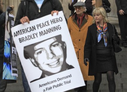 People leaving the St Paul's Cathedral annual Thanksgiving service look at a protest in support of Bradley Manning in London People leaving the St Paul's Cathedral annual Thanksgiving service look at a protest in support of Bradley Manning in London