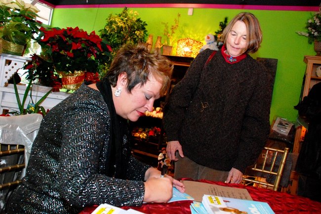 Lori Moore and the Potluck Pals set up camp at Seiverts Floral to rally support for the Kalamazoo Holiday Food Drive - 12/15/11.  The Pals chipped in to the tune of $1438!