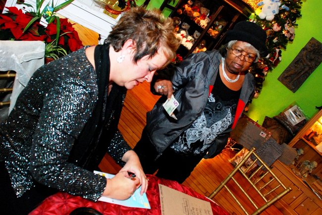 Lori Moore and the Potluck Pals set up camp at Seiverts Floral to rally support for the Kalamazoo Holiday Food Drive - 12/15/11.  The Pals chipped in to the tune of $1438!