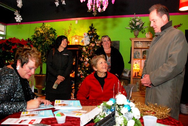 Lori Moore and the Potluck Pals set up camp at Seiverts Floral to rally support for the Kalamazoo Holiday Food Drive - 12/15/11.  The Pals chipped in to the tune of $1438!