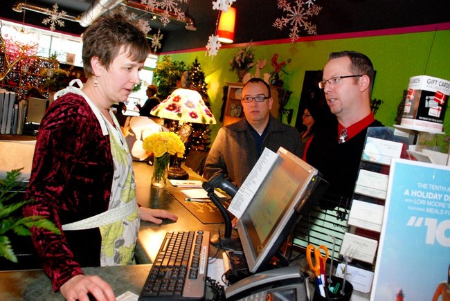 Lori Moore and the Potluck Pals set up camp at Seiverts Floral to rally support for the Kalamazoo Holiday Food Drive - 12/15/11.  The Pals chipped in to the tune of $1438!