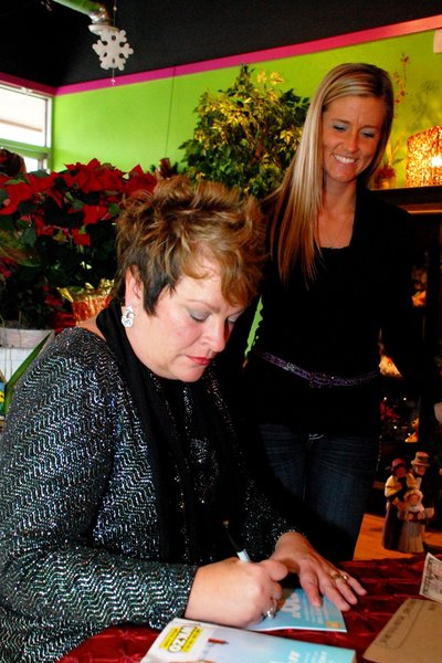 Lori Moore and the Potluck Pals set up camp at Seiverts Floral to rally support for the Kalamazoo Holiday Food Drive - 12/15/11.  The Pals chipped in to the tune of $1438!