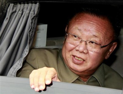 North Korean leader Kim Jong-il looks out from his car after meeting Russia's President Dmitry Medvedev at the "Sosnovyi Bor" military garri North Korean leader Kim Jong-il looks out from his car after meeting Russia's President Dmitry Medvedev at the "Sosnovyi Bor" military garri