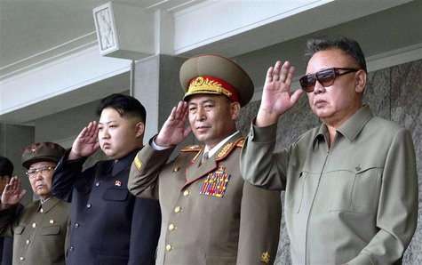 North Korean leader Kim Jong-il and his son Kim Jong Un salute as they watch soldiers attending a military parade in the Kim Il Sung square North Korean leader Kim Jong-il and his son Kim Jong Un salute as they watch soldiers attending a military parade in the Kim Il Sung square