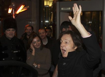 Former Beatle McCartney greets fans as he leaves a hotel before driving to Olympiysky complex to perform in a concert, in Moscow Former Beatle McCartney greets fans as he leaves a hotel before driving to Olympiysky complex to perform in a concert, in Moscow