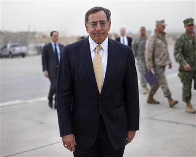 U.S. Secretary of Defense Leon Panetta walks across the tarmac towards his C-17 plane during his departure from Baghdad U.S. Secretary of Defense Leon Panetta walks across the tarmac towards his C-17 plane during his departure from Baghdad