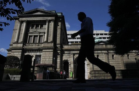 A man walks past the Bank of Japan headquarters building in Tokyo A man walks past the Bank of Japan headquarters building in Tokyo