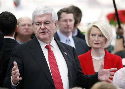 Republican presidential candidate and former U.S. House Speaker Newt Gingrich and his wife Callista talk to customers at the Hy-Vee grocery Republican presidential candidate and former U.S. House Speaker Newt Gingrich and his wife Callista talk to customers at the Hy-Vee grocery