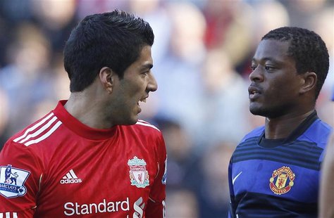 File photo of Liverpool's Suarez and Manchester United's Evra looking at each other during their English Premier League soccer match at Anfi File photo of Liverpool's Suarez and Manchester United's Evra looking at each other during their English Premier League soccer match at Anfi