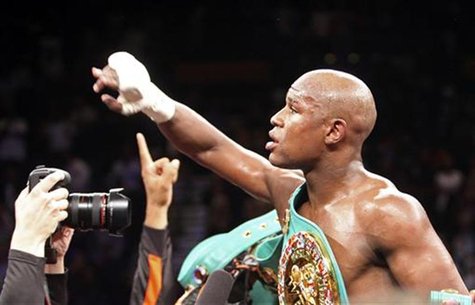 Mayweather Jr. of the U.S. celebrates his victory over WBC welterweight champion Ortiz, also of the U.S., after their title fight in Las Veg Mayweather Jr. of the U.S. celebrates his victory over WBC welterweight champion Ortiz, also of the U.S., after their title fight in Las Veg