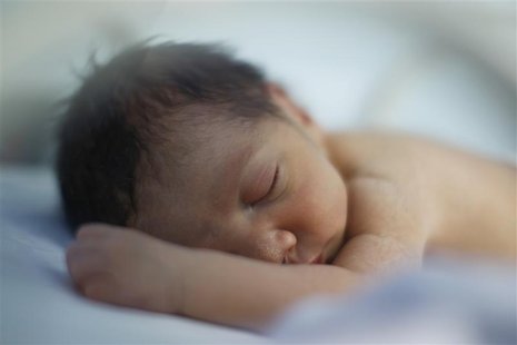 A premature baby sleeps in an incubator in the natal intensive care unit in a public maternity hospital in Gatire A premature baby sleeps in an incubator in the natal intensive care unit in a public maternity hospital in Gatire