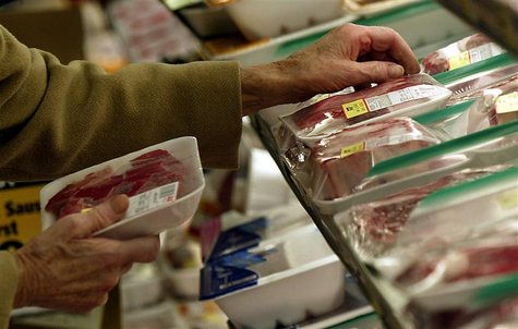 An unidentified shopper looks over the selection of steaks at local grocery store in Chicago, Decemb.. An unidentified shopper looks over the selection of steaks at local grocery store in Chicago, Decemb..