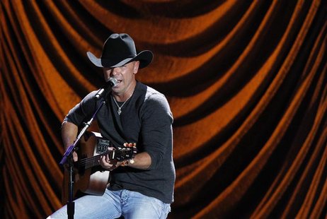Kenny Chesney performs during "A Decade of Difference: A Concert Celebrating 10 Years of the William J. Clinton Foundation" at the Hollywood Kenny Chesney performs during "A Decade of Difference: A Concert Celebrating 10 Years of the William J. Clinton Foundation" at the Hollywood
