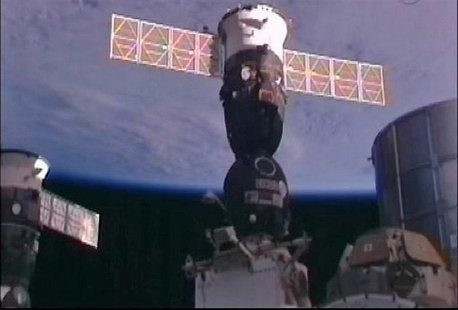 Still image taken from NASA TV shws Russian Soyuz TMA-03M spacecraft docked to the International Space Station Still image taken from NASA TV shws Russian Soyuz TMA-03M spacecraft docked to the International Space Station