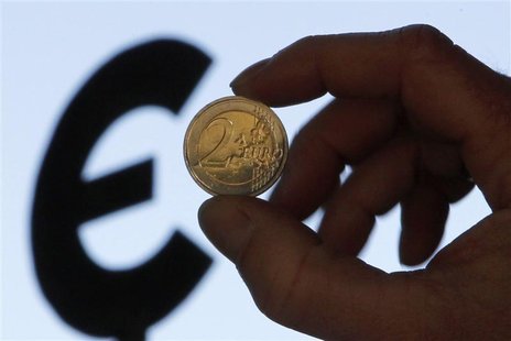A picture illustration shows a two euro coin outside the European Parliament in Brussels A picture illustration shows a two euro coin outside the European Parliament in Brussels