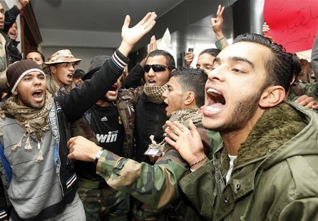 Former fighters protest at the office of Libya's Prime Minister Abdurrahim El-Keib in Tripoli Former fighters protest at the office of Libya's Prime Minister Abdurrahim El-Keib in Tripoli